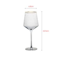 Luxury red wine glass with elegant gold rim painting and laser flower