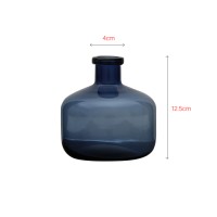 Blue colored glass round vase bottle