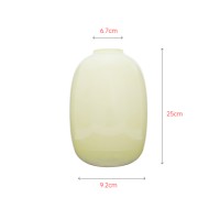 Colored yellow round glass vase