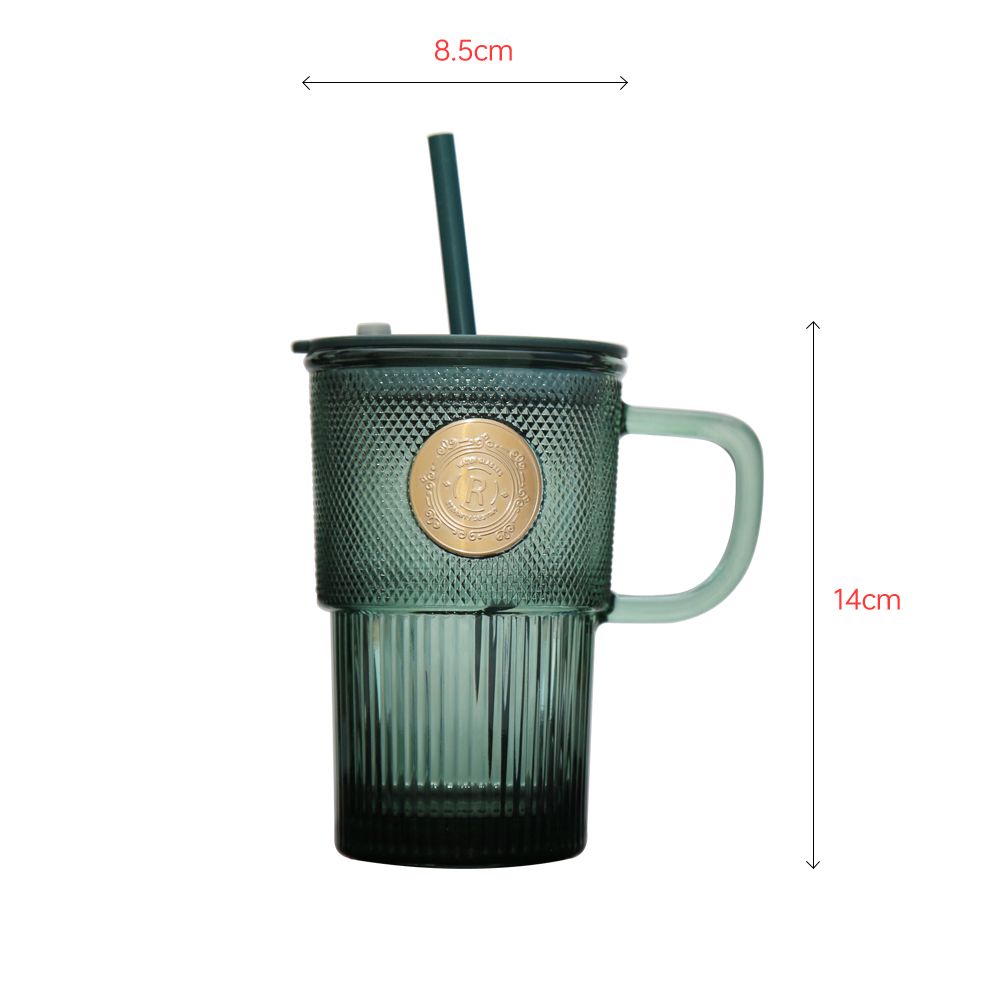 Classic green colored glass cup with straw