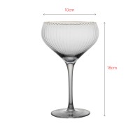 Luxury crystal cocktail glass with elegant gold rim and vertical texture design