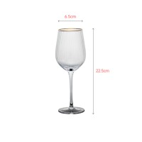 Luxury red wine glass with elegant gold rim painting
